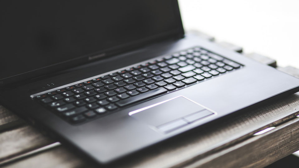 trans-history_laptop-on-table_960x540